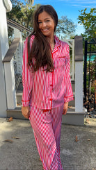 satin red stripe christmas pajama set with red velvet details and belt pant set button down closure long sleeve close