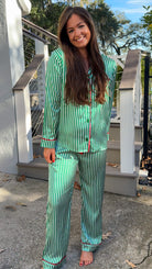 satin green stripe christmas pajama set with red velvet details and belt pant set button down closure long sleeve close