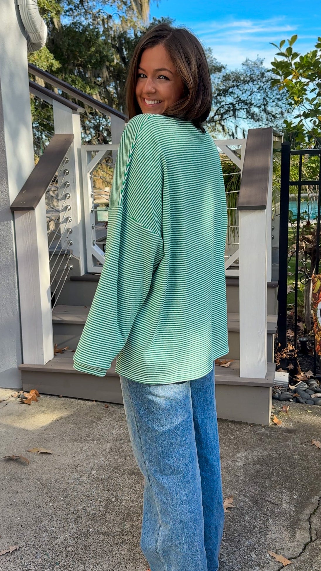 green and white striped oversized sweater top cozy comfy long sleeve side view