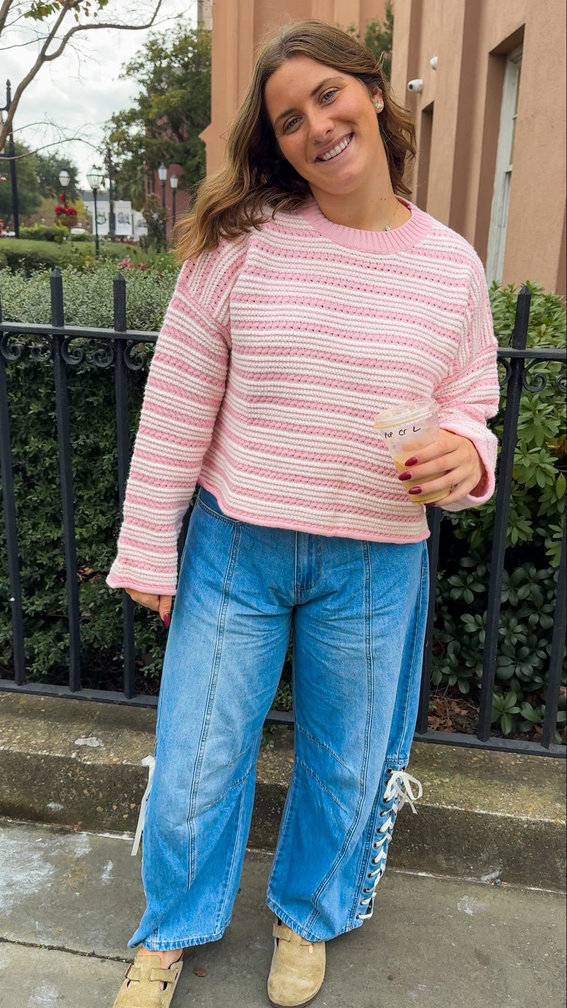 denim barrel jeans lace up side detail and pink and white sweater top