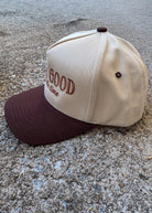 Cap with 'God is Good All the time' text on a concrete surface, trucker hat, christian trucker hat