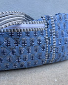 blue quilted block print duffle bag