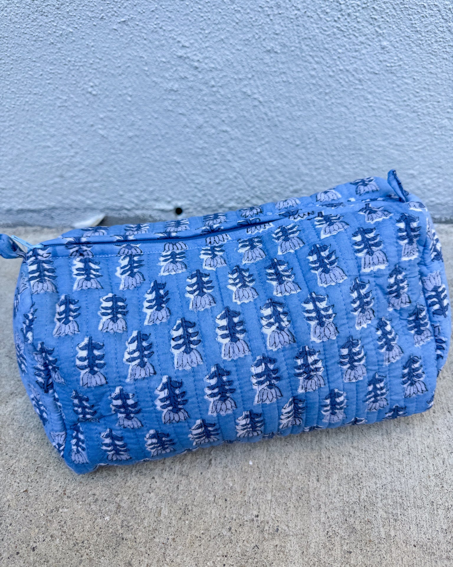 blue quilted block print cosmetic makeup bag
