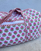 Floral patterned fabric on a flat surface with a light blue background