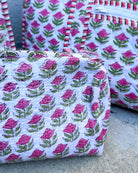 Fabric bags with floral pattern on a concrete surface