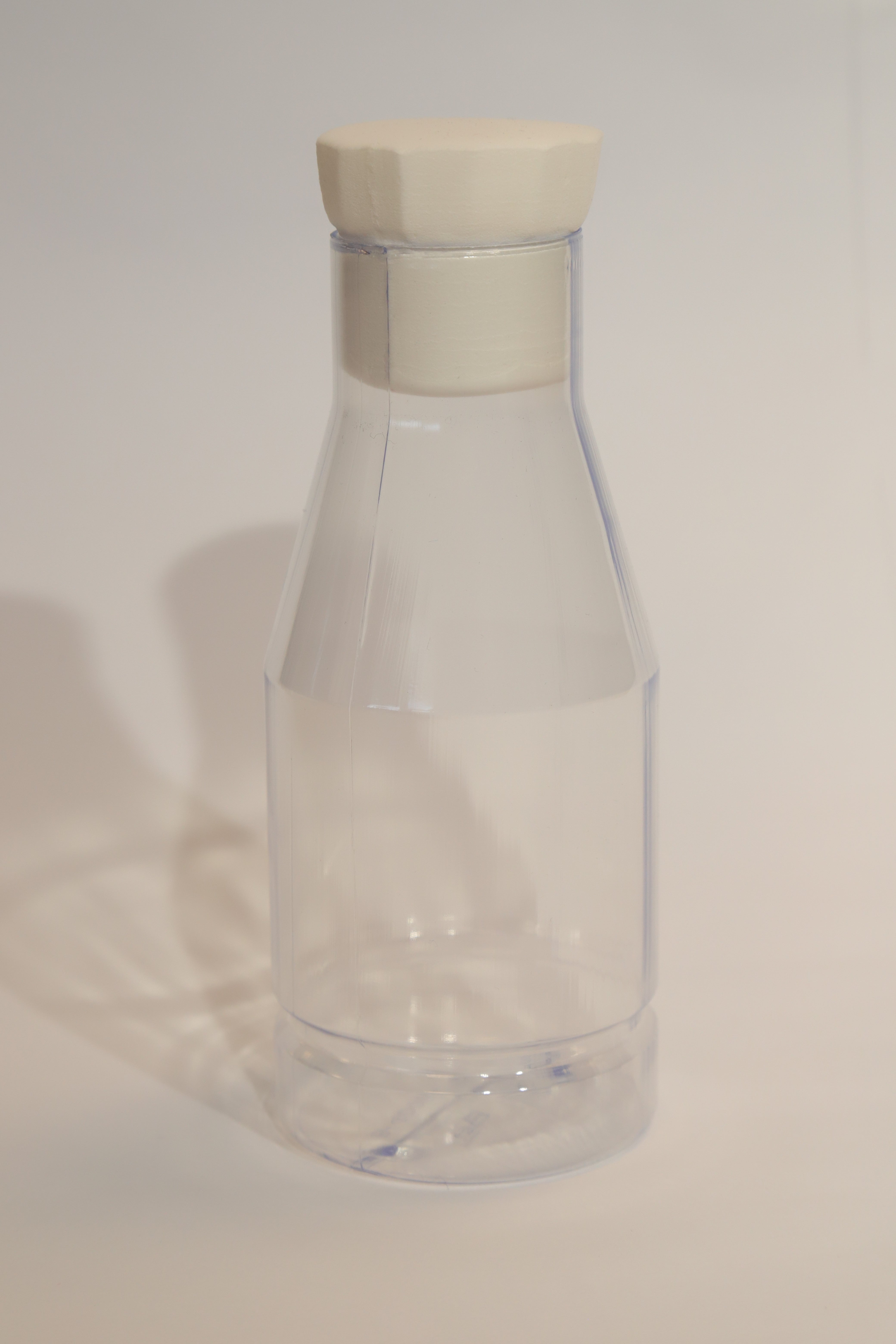 Gold necklace with a cross pendant on a card with text and other cards in the background.