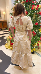 Champagne tiered jacquard maxi dress with bubble sleeves and self-tie open back — Sloane Maxi. gold and cream holiday dress