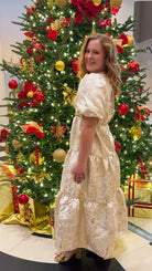 Champagne tiered jacquard maxi dress with bubble sleeves and self-tie open back — Sloane Maxi. gold and cream holiday dress