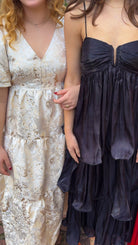 Champagne tiered jacquard maxi dress with bubble sleeves and self-tie open back — Sloane Maxi. gold and cream holiday dress