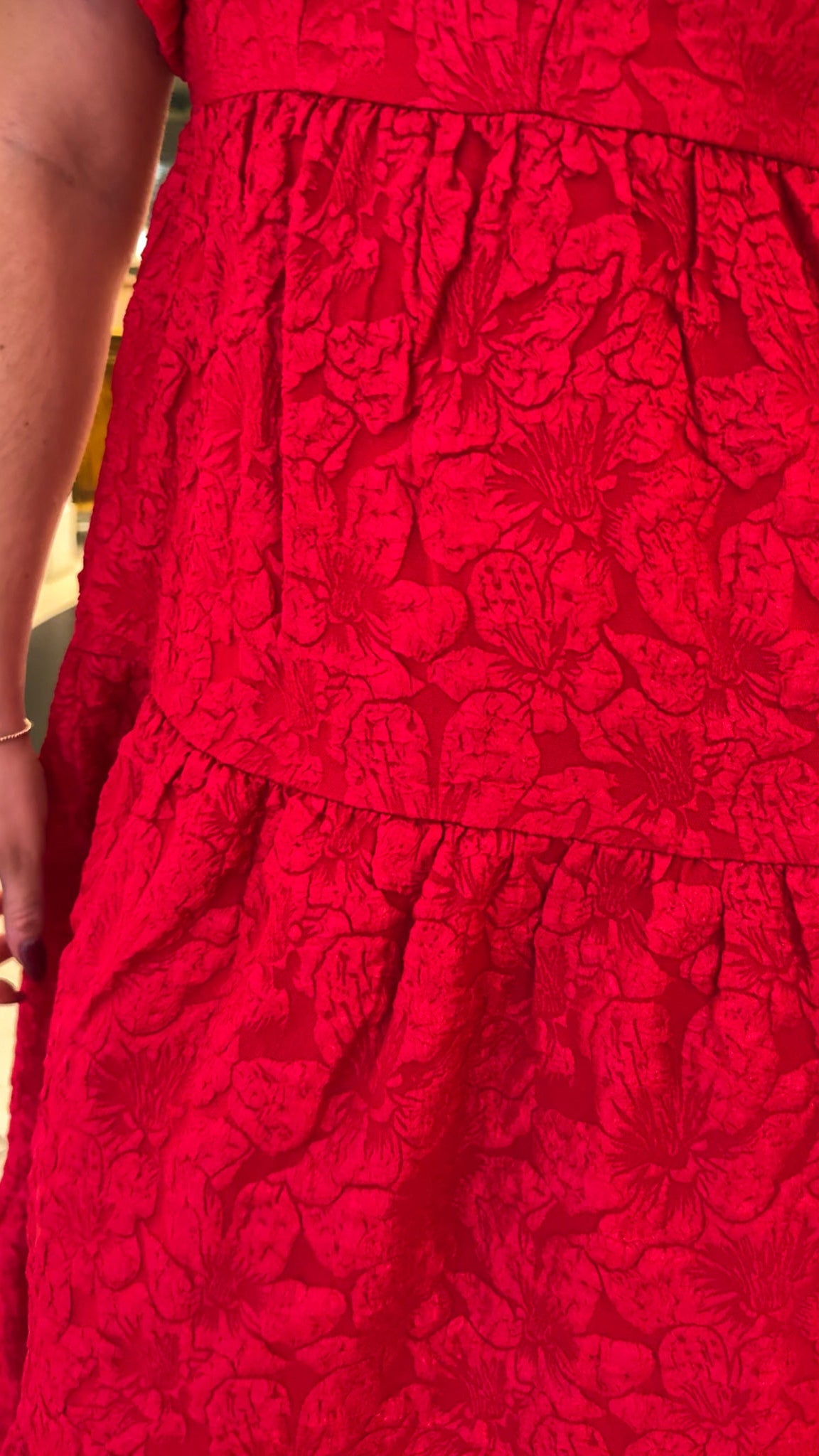 red jacquard maxi dress with puff sleeves and tiered skirt bottom and open back tie bow v neck holiday christmas dress