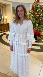 Shimmer crinkled long sleeve tiered midi dress with V-neckline, stand collar, waist tie belt, and flowing skirt.