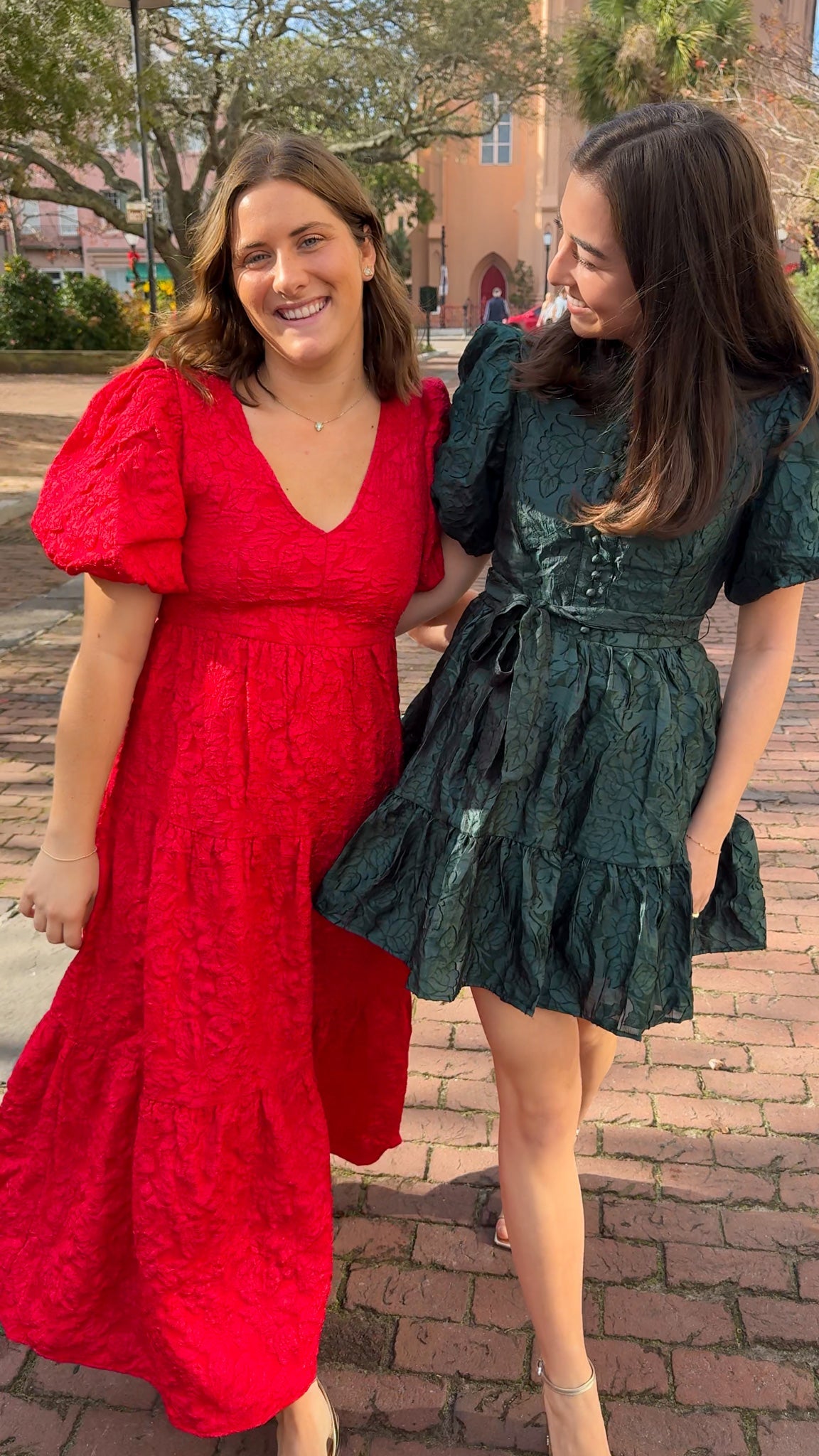 red jacquard maxi dress with puff sleeves and tiered skirt bottom and open back tie bow v neck holiday christmas dress