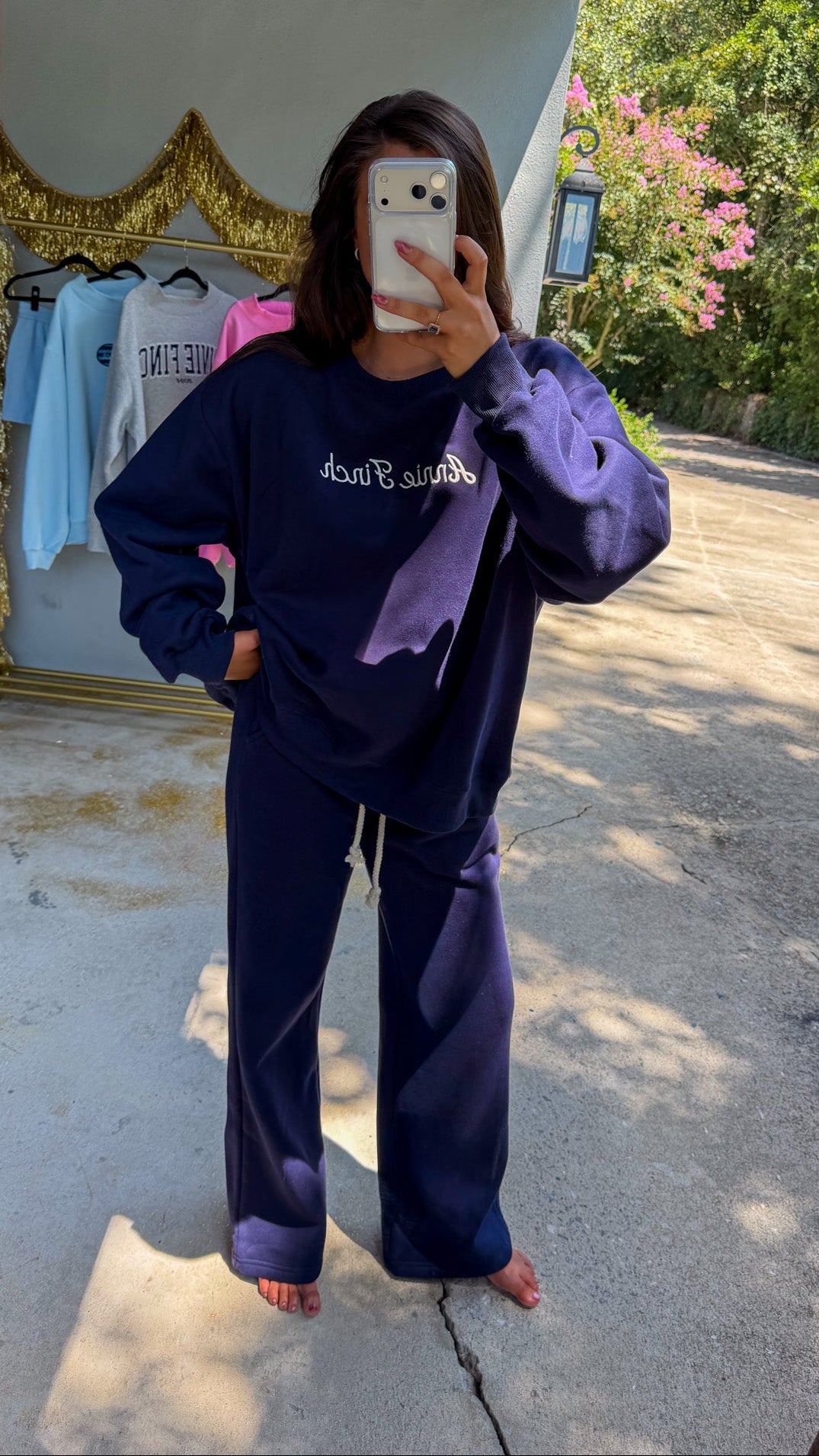navy crewneck sweatshirt with white script "annie finch" embroidery with navy wideleg sweatpants