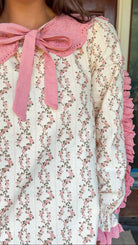 Cream rose stripe floral mini dress with pink scalloped lace collar and ribbon tie.