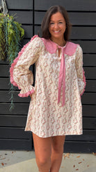 Cream rose stripe floral mini dress with pink scalloped lace collar and ribbon tie.