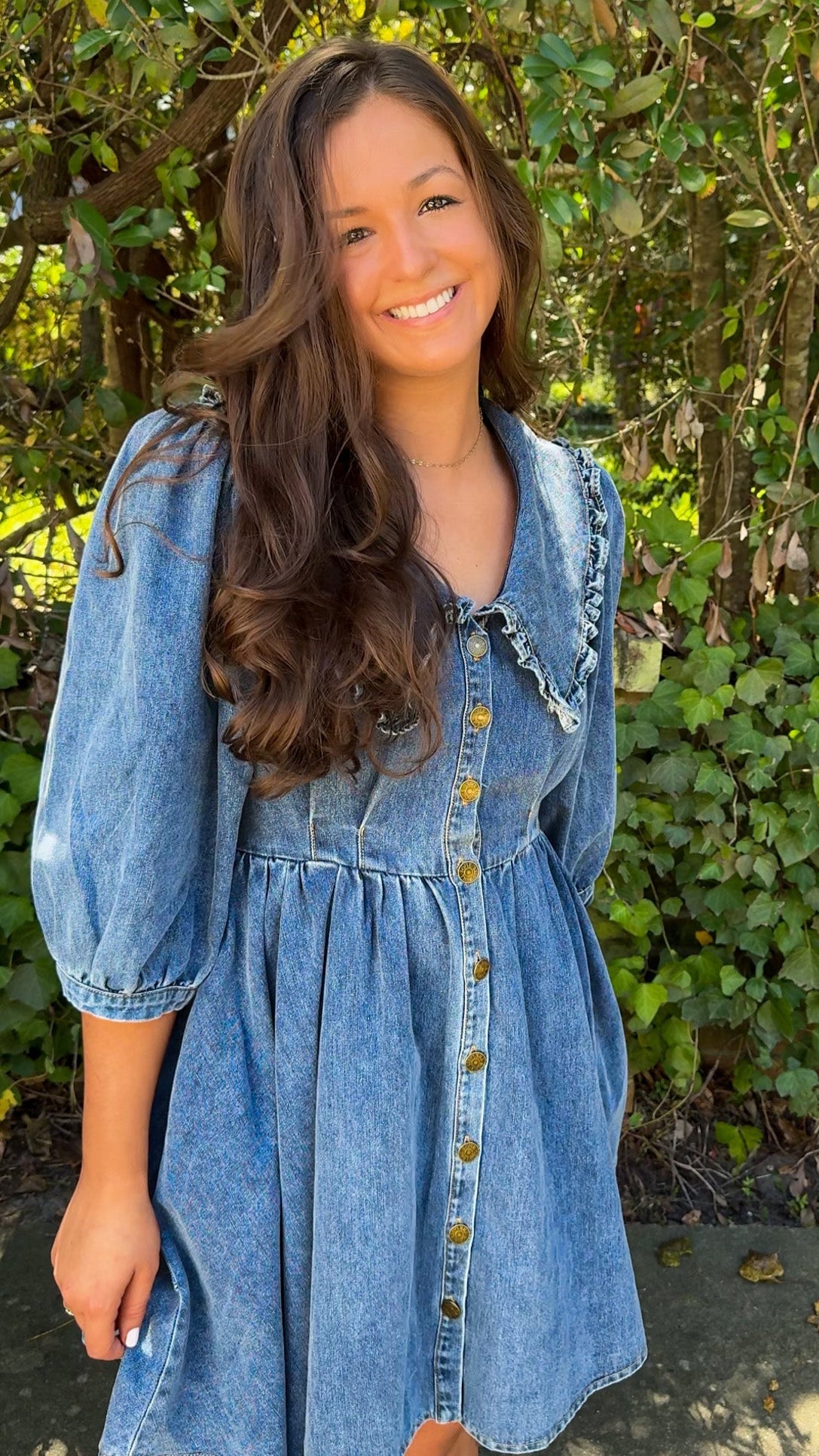 front/side view of denim mini dress with oversized collar and 3/4 sleeves