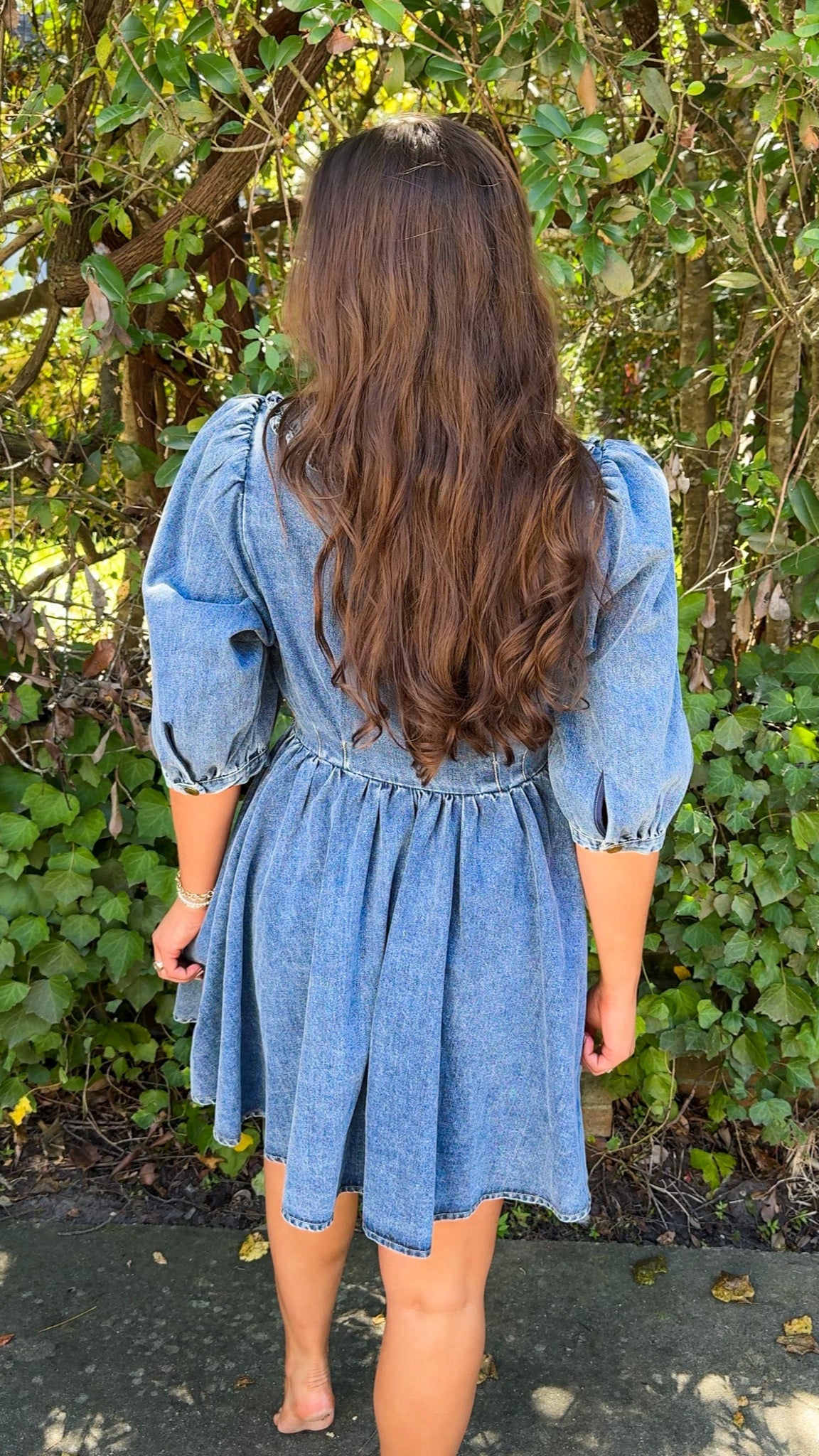 back view of denim mini dress with oversized collar and 3/4 sleeves
