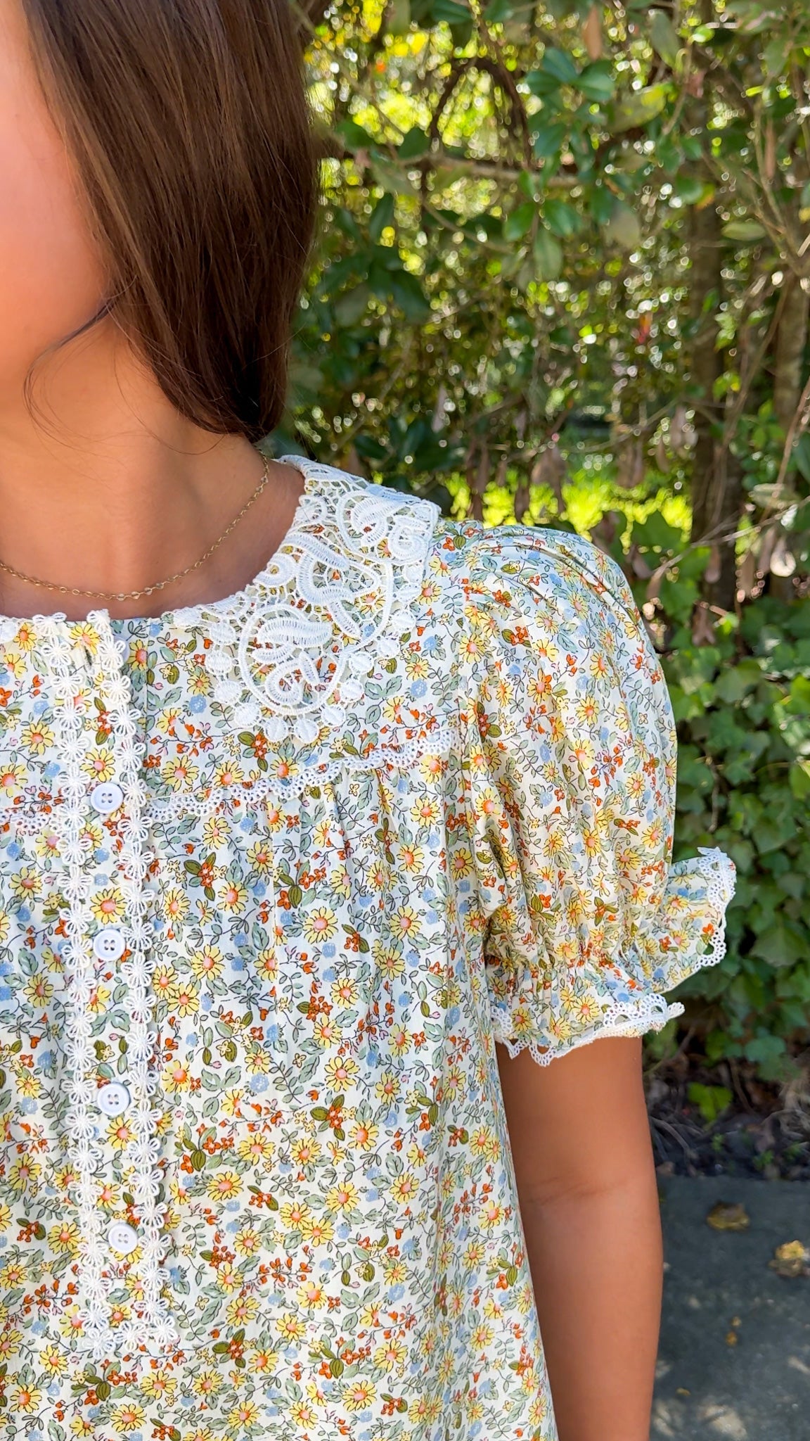 close up view of fall floral mini dress with lace collar and detailing 