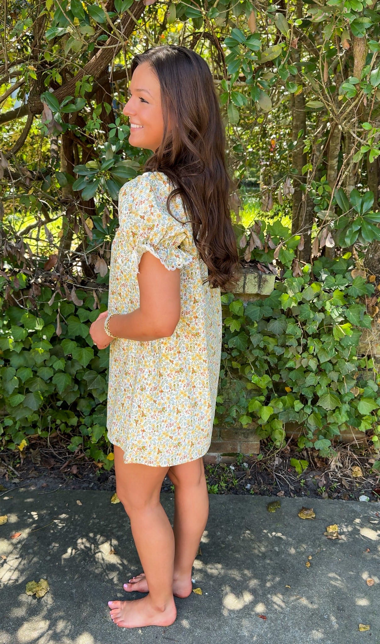 side 2 view of fall floral mini dress with lace collar and detailing 