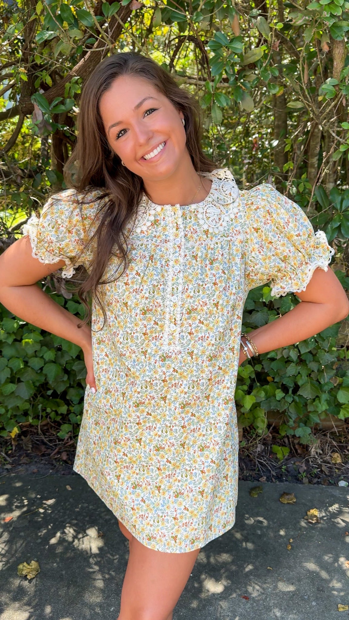front far away view of fall floral mini dress with lace collar and detailing 
