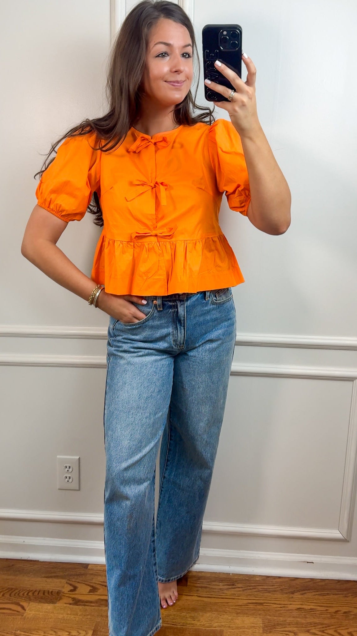 orange tie top blouse with puff sleeves front far away