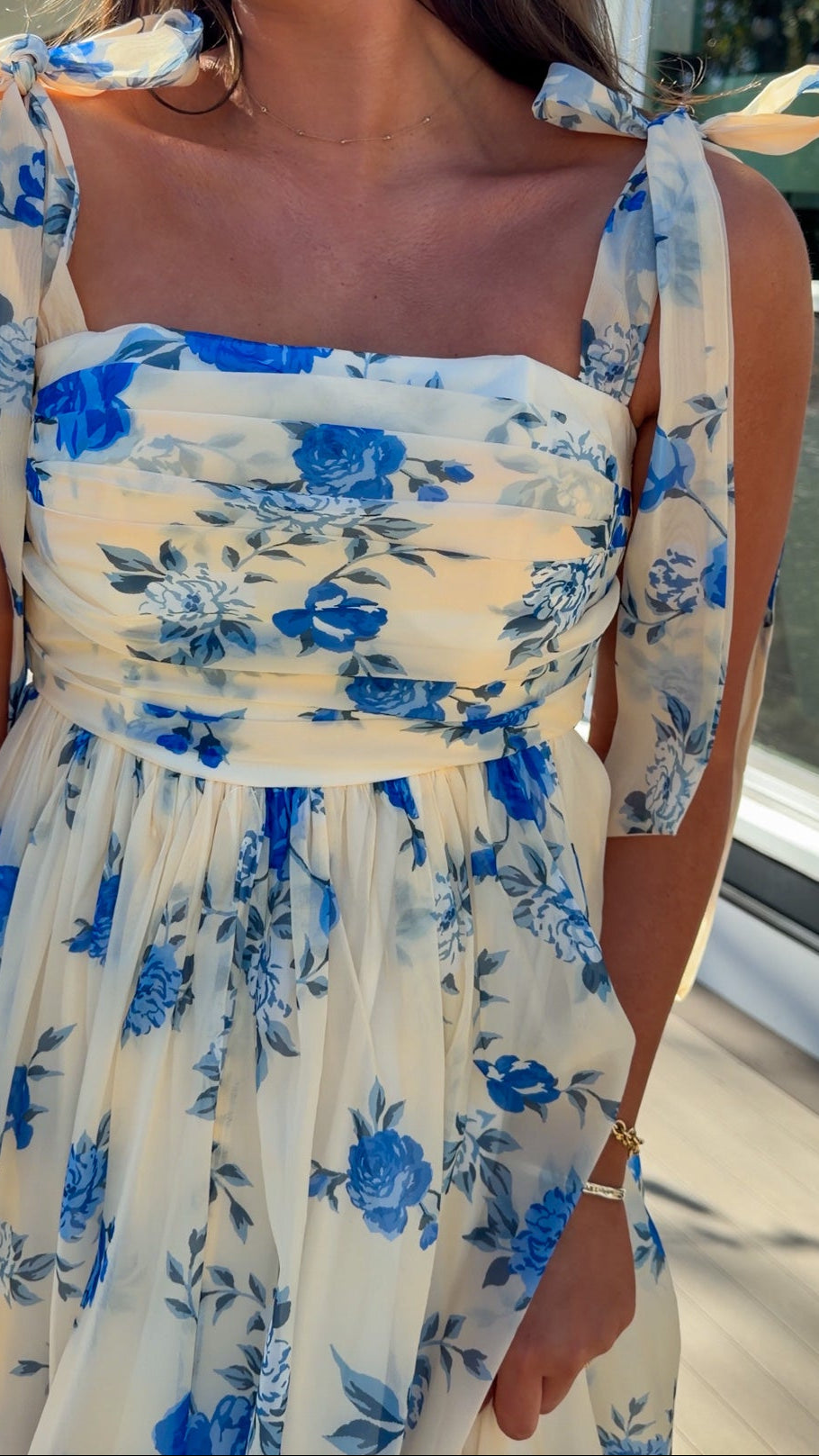 women's floral blue cream midi dress with smocked detailing and tie straps flowy