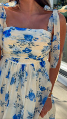 women's floral blue cream midi dress with smocked detailing and tie straps flowy