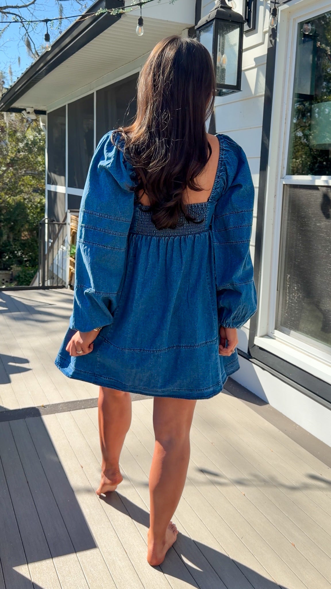 Women’s blue denim babydoll dress featuring a square neckline, long puff sleeves, and a loose, comfortable silhouette.