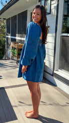 Women’s blue denim babydoll dress featuring a square neckline, long puff sleeves, and a loose, comfortable silhouette.
