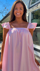 baby pink midi dress with flutter sleeves and tiered ruffle hem