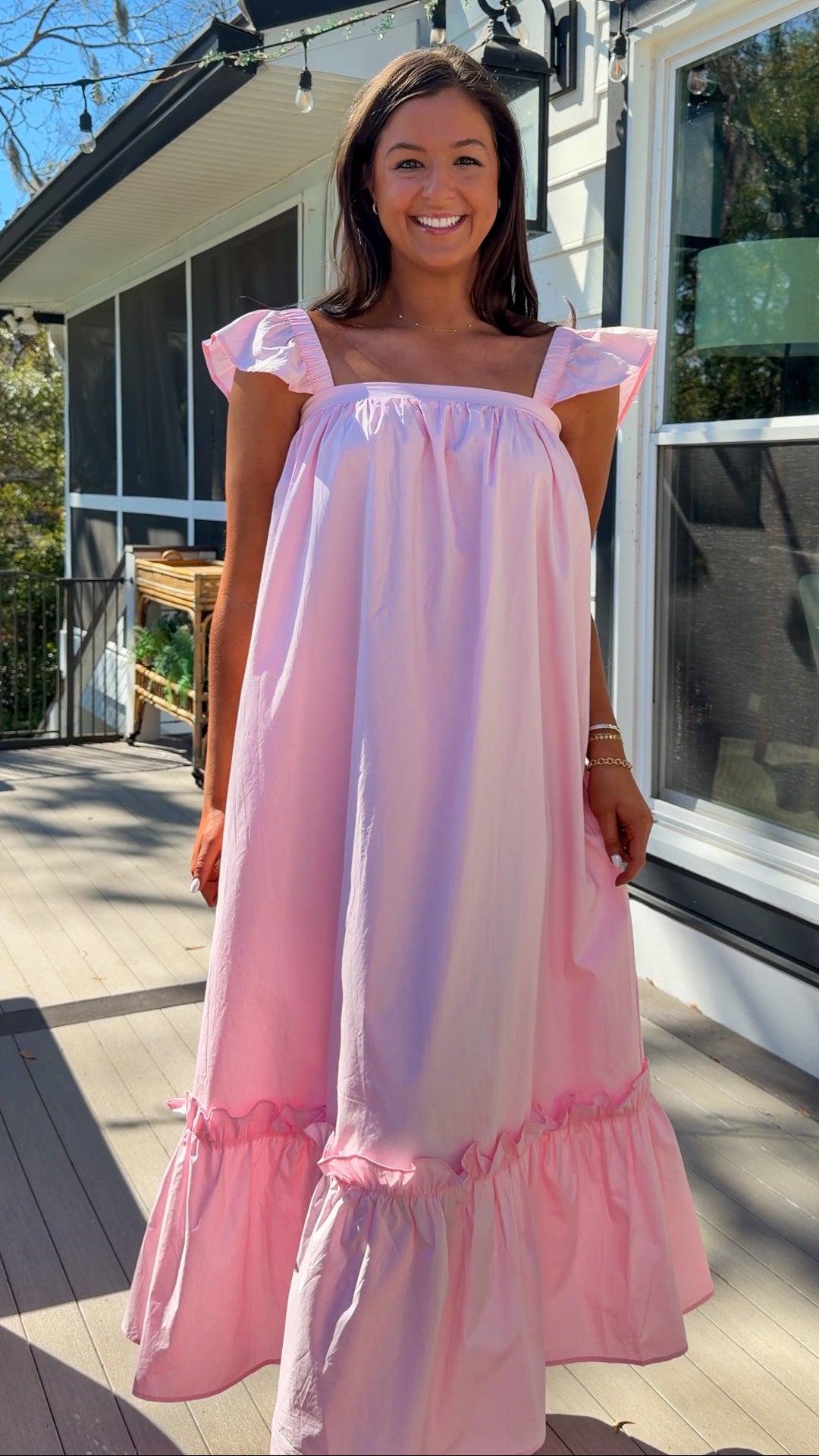 baby pink midi dress with flutter sleeves and tiered ruffle hem