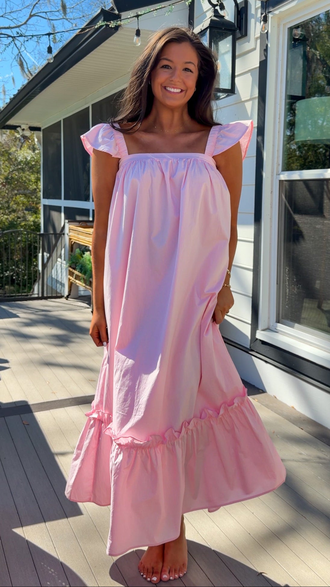 baby pink midi dress with flutter sleeves and tiered ruffle hem