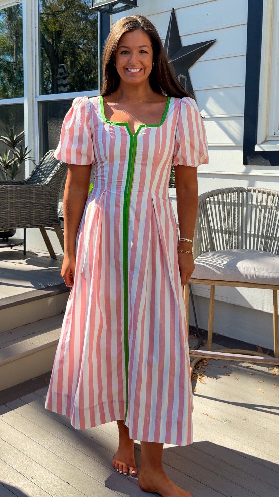 pink striped midi dress with green contrast trim and puff sleeves