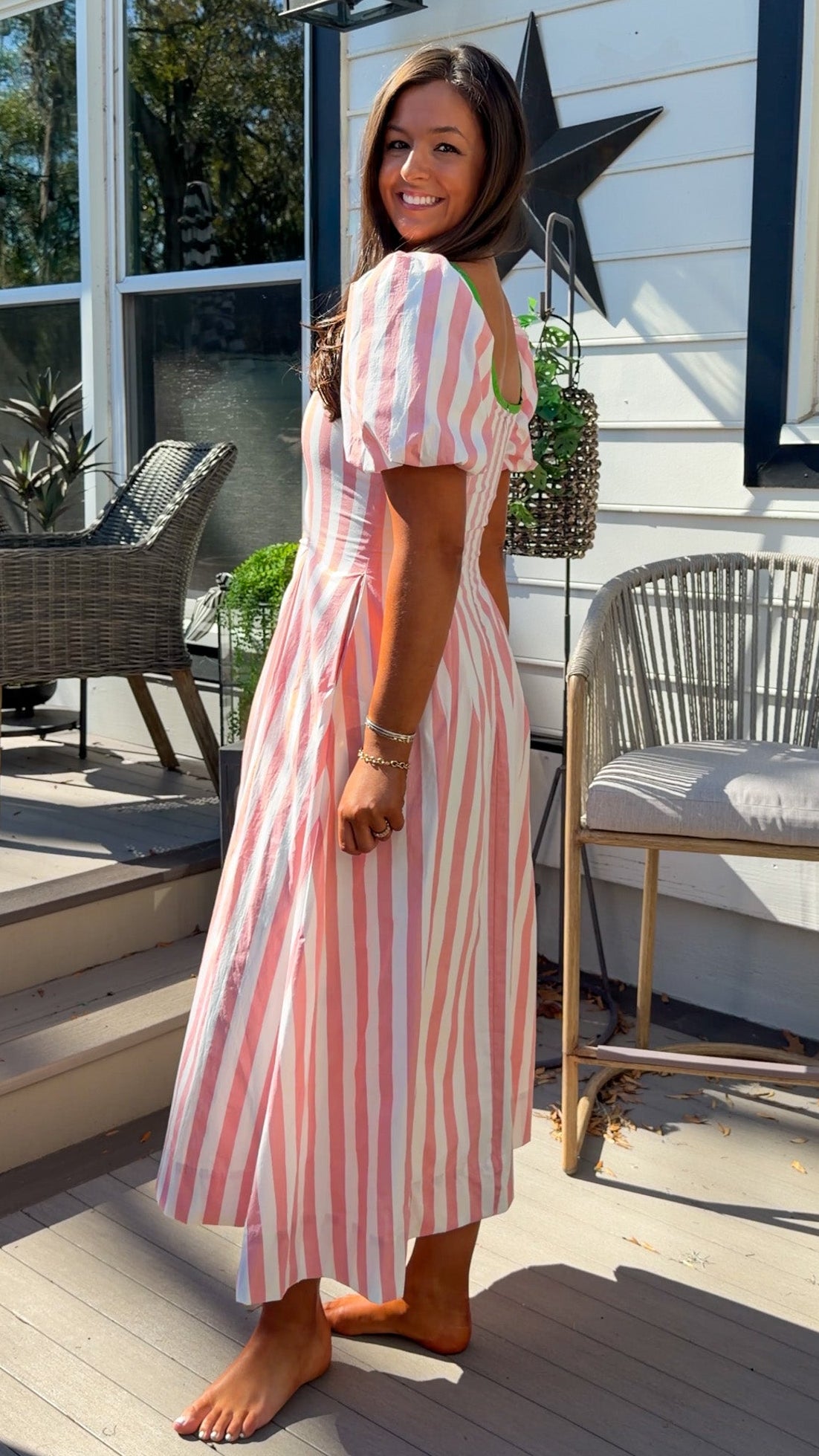 pink striped midi dress with green contrast trim and puff sleeves