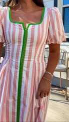 pink striped midi dress with green contrast trim and puff sleeves