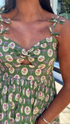 green floral sweetheart neckline midi dress with bow straps and chest cutout