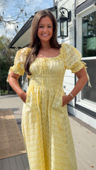 Yellow eyelet lace maxi dress with smocked bodice and puff sleeves