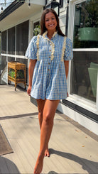 Blue gingham puff sleeve romper with lace trim and ruffle collar