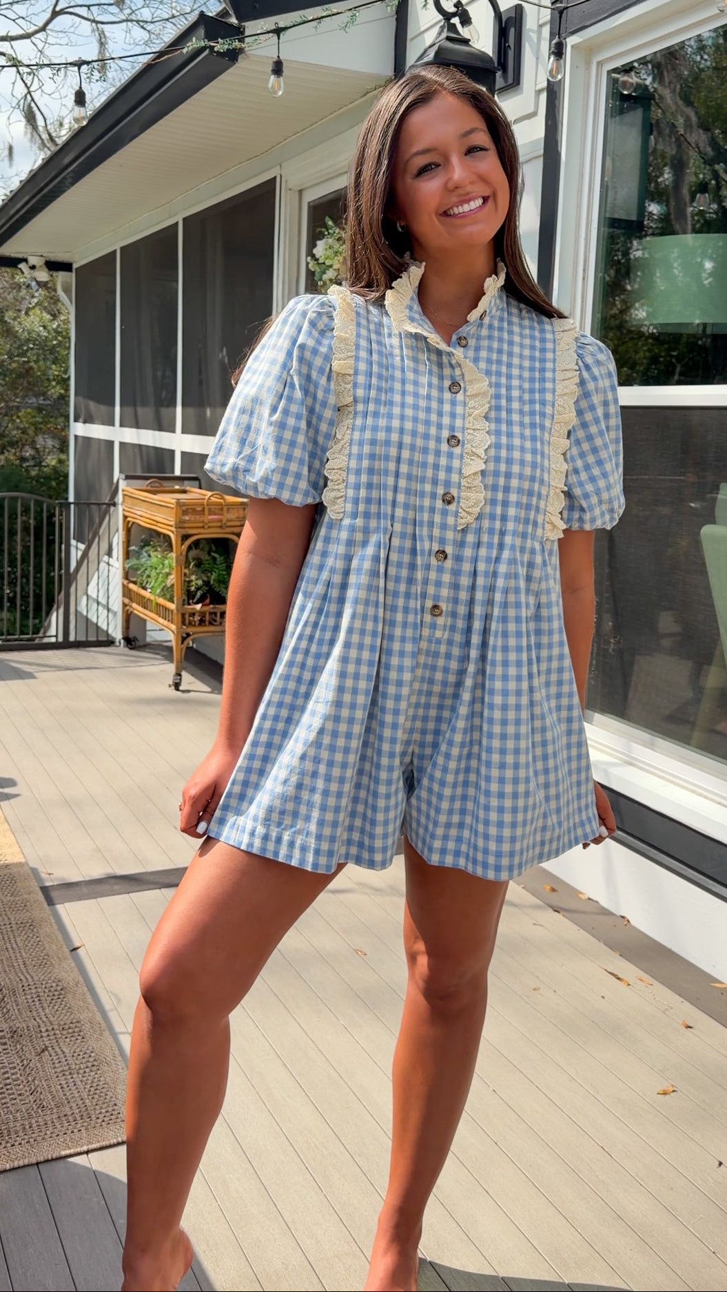Blue gingham puff sleeve romper with lace trim and ruffle collar