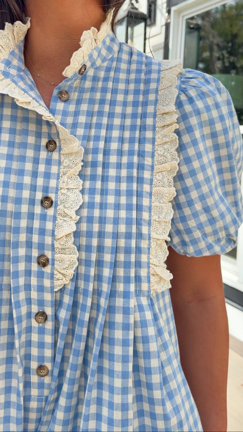 Blue gingham puff sleeve romper with lace trim and ruffle collar