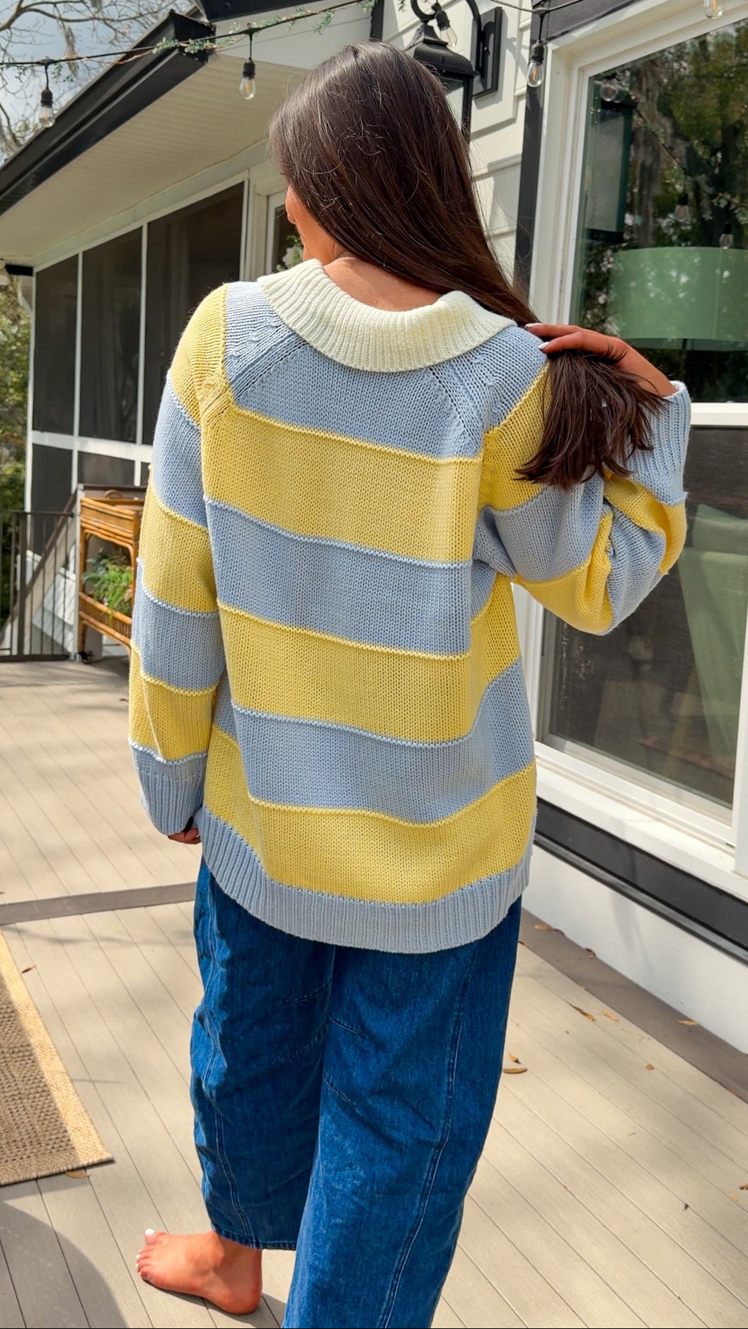 Oversized blue and yellow striped collared knit sweater with button placket