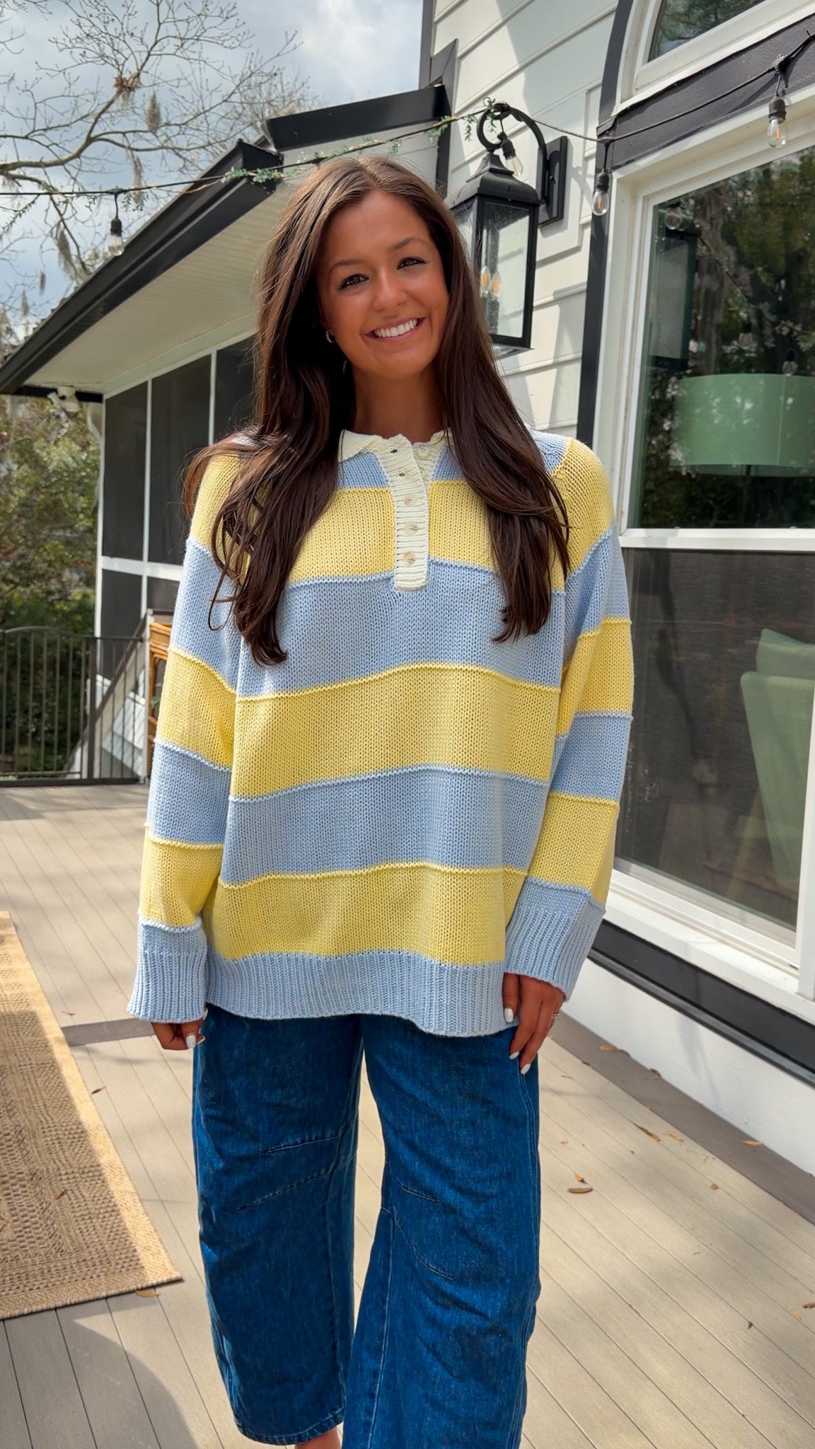 Oversized blue and yellow striped collared knit sweater with button placket