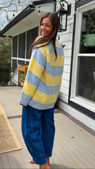 Oversized blue and yellow striped collared knit sweater with button placket