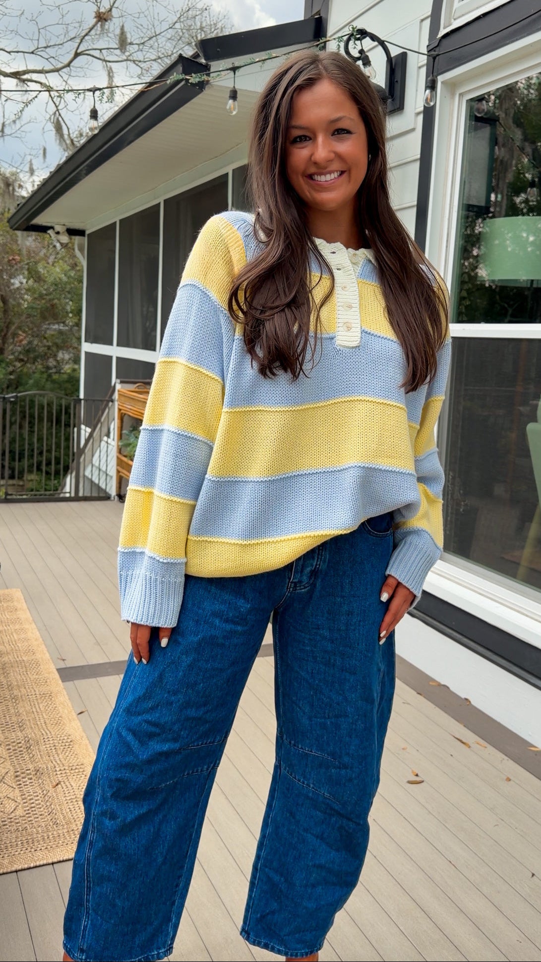 Oversized blue and yellow striped collared knit sweater with button placket