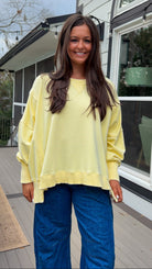 mineral washed oversized yellow pullover with ribbed trim and relaxed fit. vintage soft fleece oversized sweatshirt in pastel yellow casual everyday style