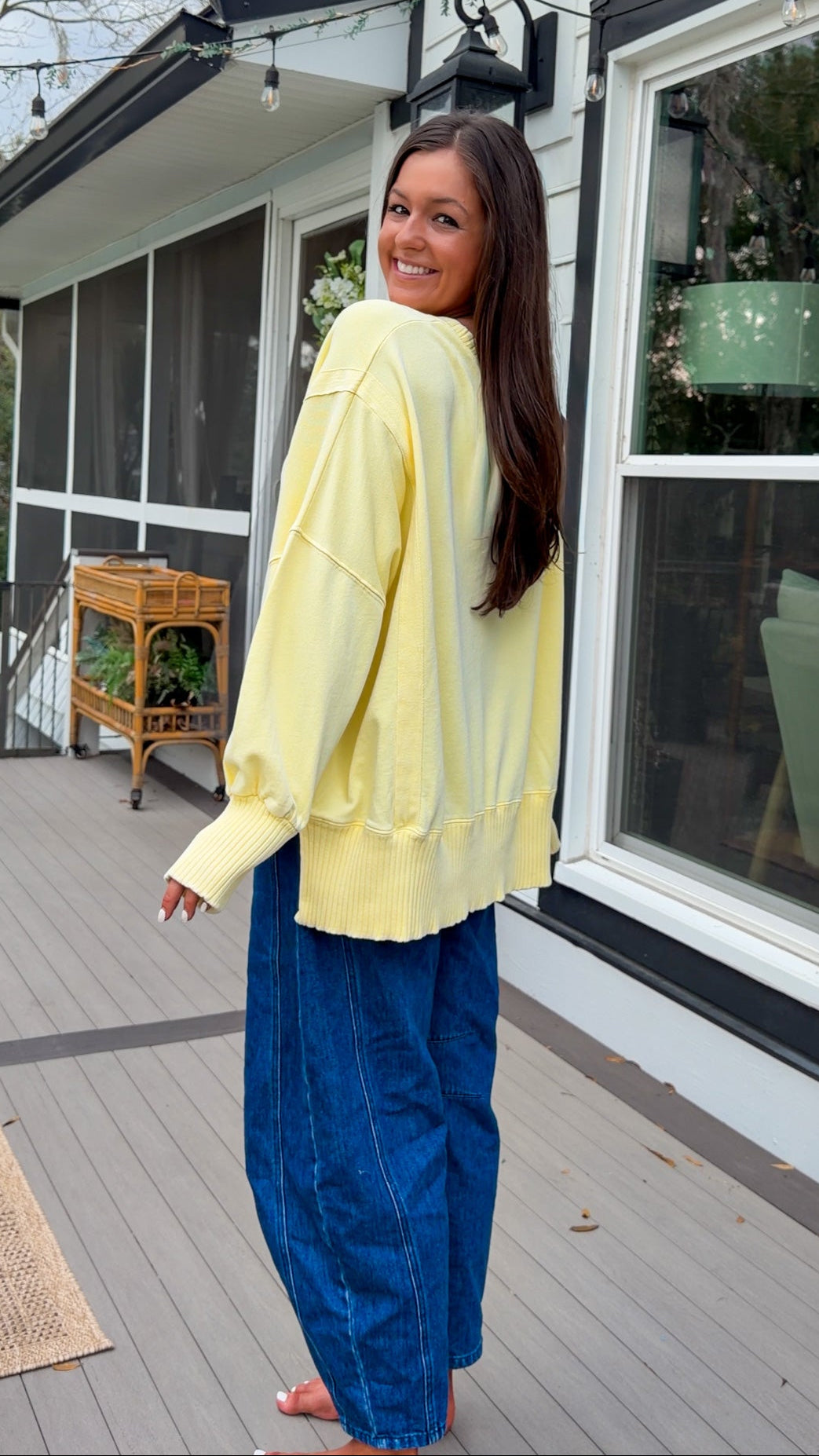 mineral washed oversized yellow pullover with ribbed trim and relaxed fit. vintage soft fleece oversized sweatshirt in pastel yellow casual everyday style