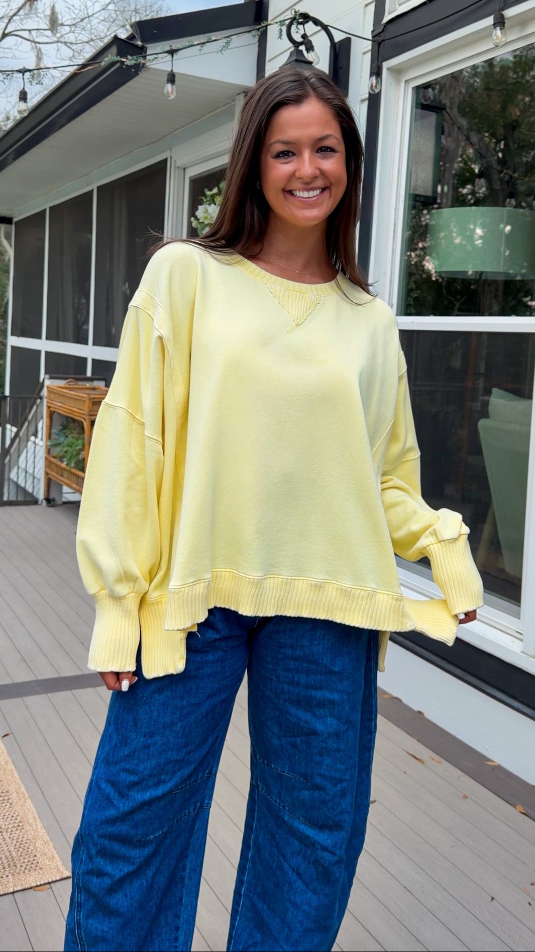 mineral washed oversized yellow pullover with ribbed trim and relaxed fit. vintage soft fleece oversized sweatshirt in pastel yellow casual everyday style