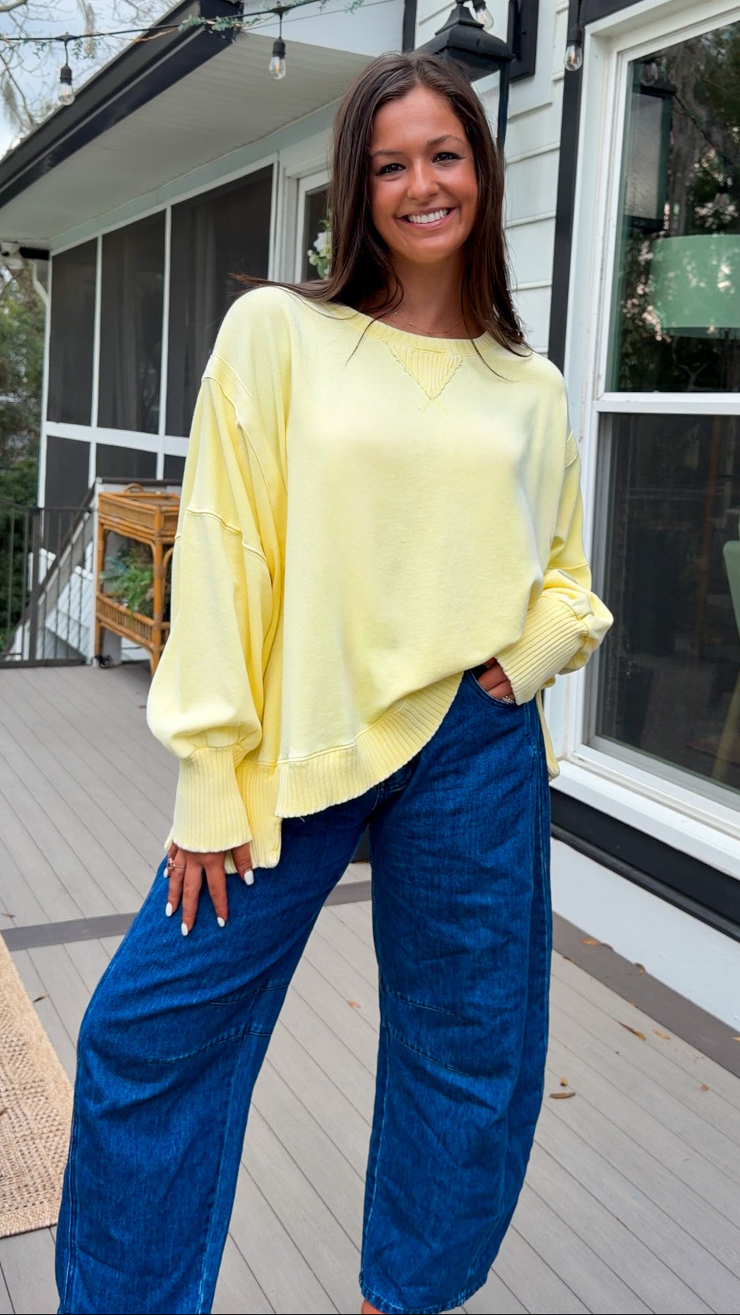 mineral washed oversized yellow pullover with ribbed trim and relaxed fit. vintage soft fleece oversized sweatshirt in pastel yellow casual everyday style