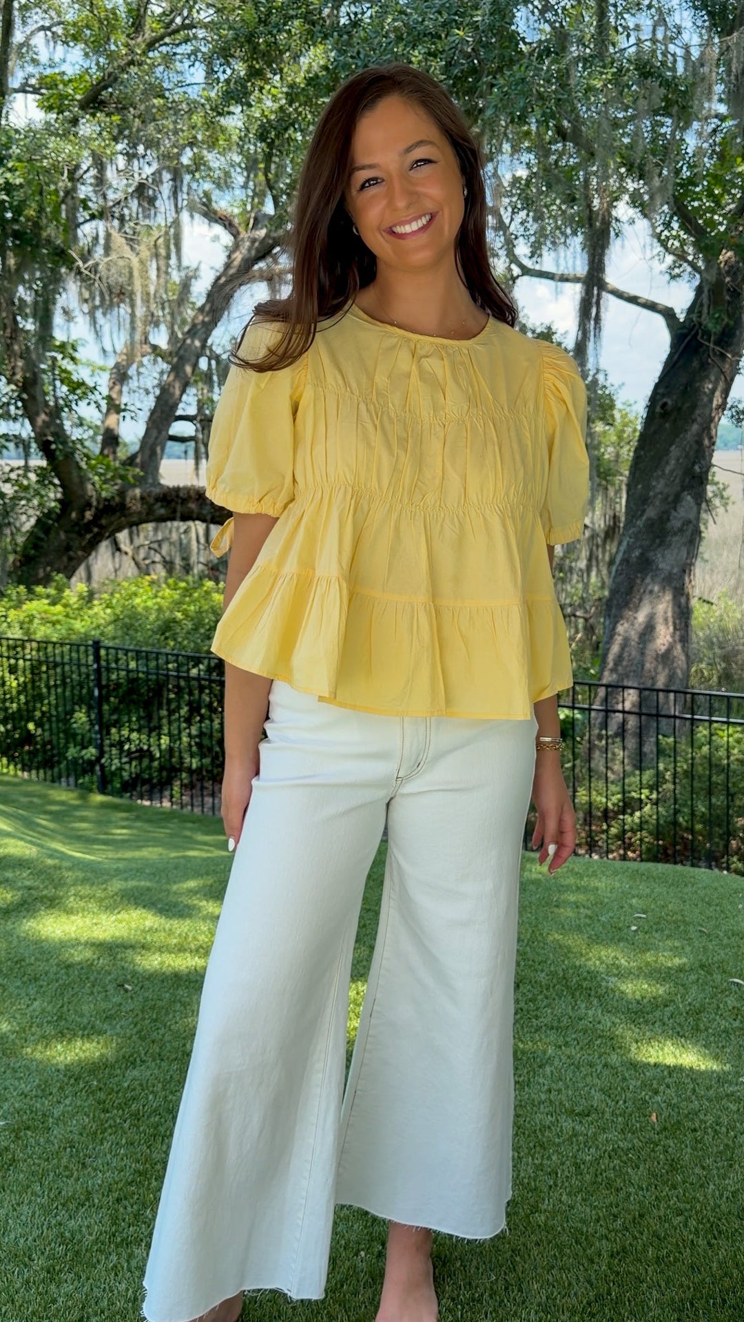 White high-rise wide leg denim jeans featuring contrast stitching, a cropped raw hem, front and back pockets, and a flattering structured fit.